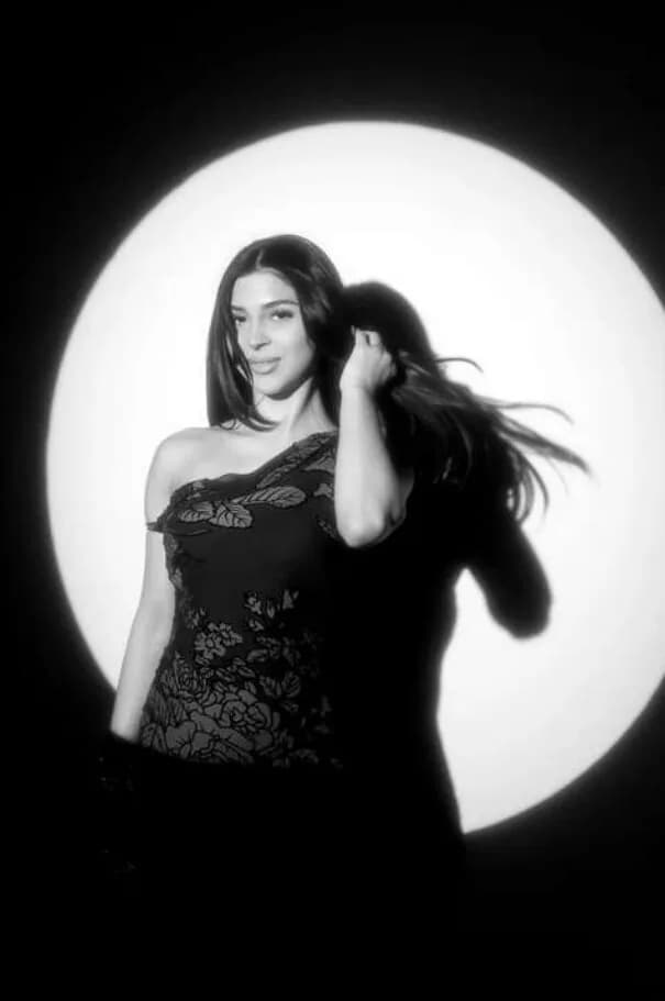 Black-and-white spotlight portrait