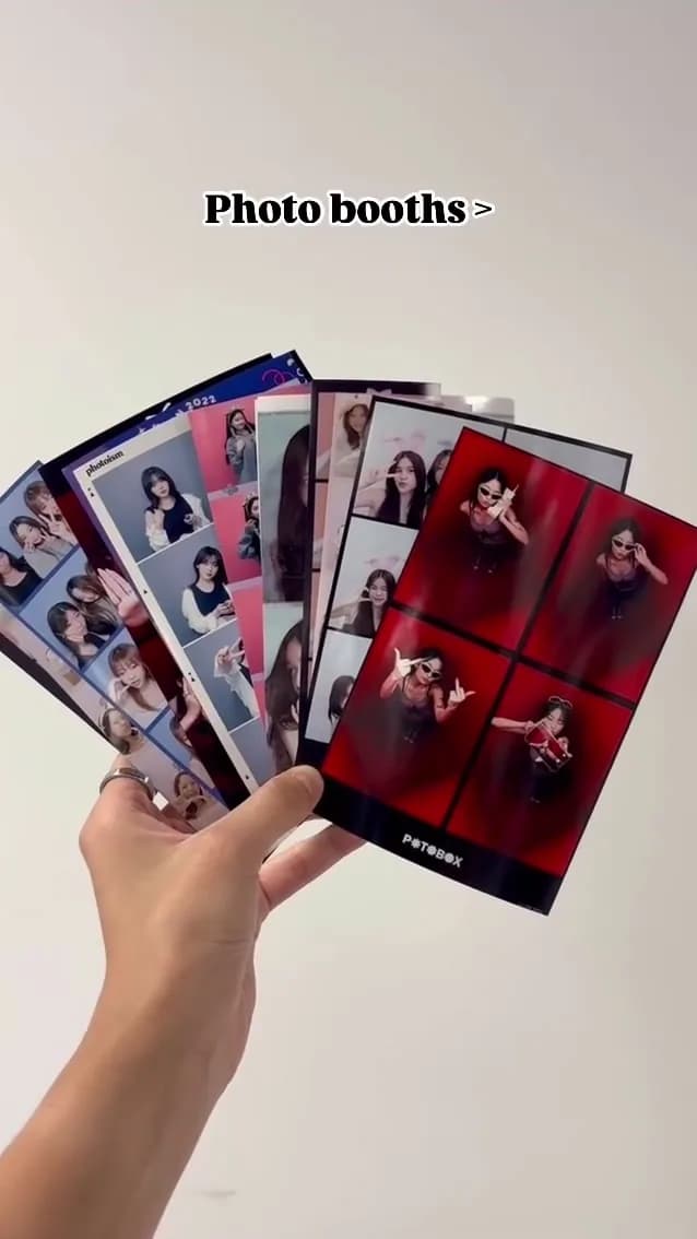 Hands holding a fan of photo strips