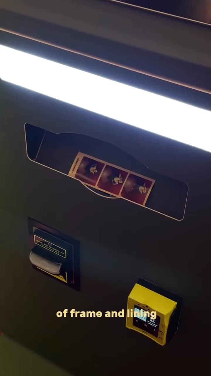 Photo booth printing a photo strip