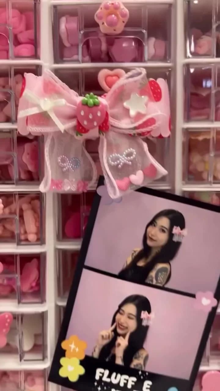 Photo strips displayed in a pink store
