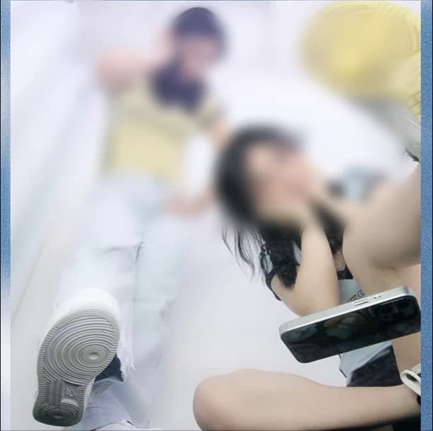 2 people posing on the Low Angle photo booth