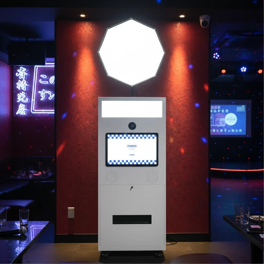 Portable photo booth with flash extension inside a bar