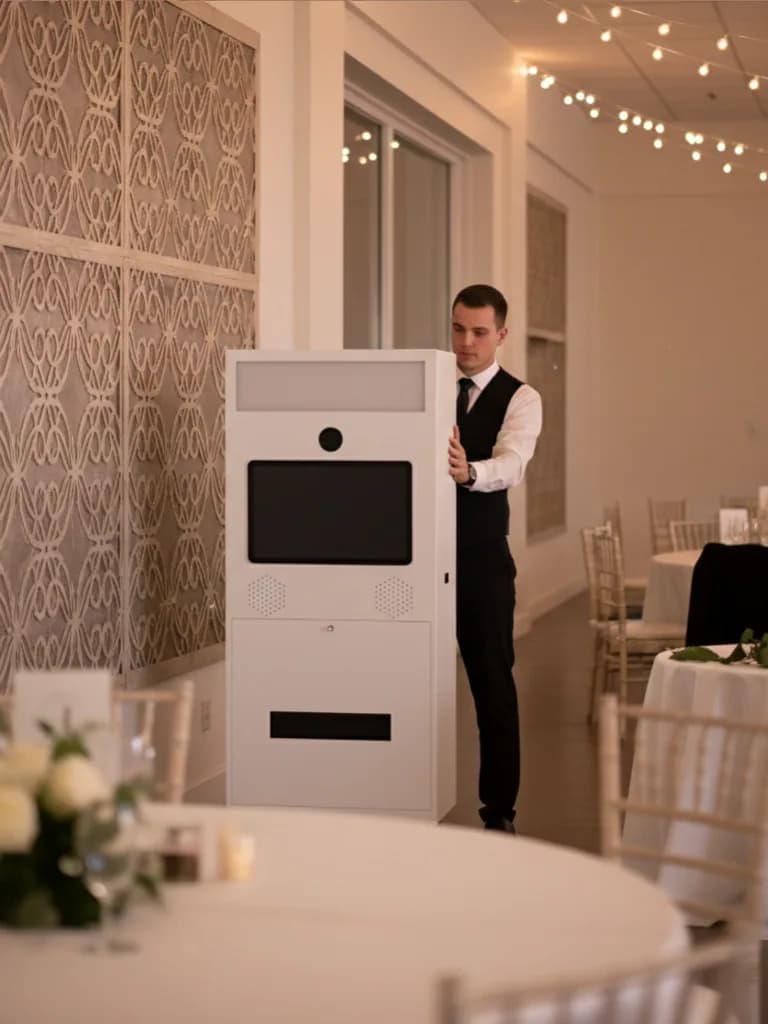 Setting up the Portable photo booth machine inside a wedding venue