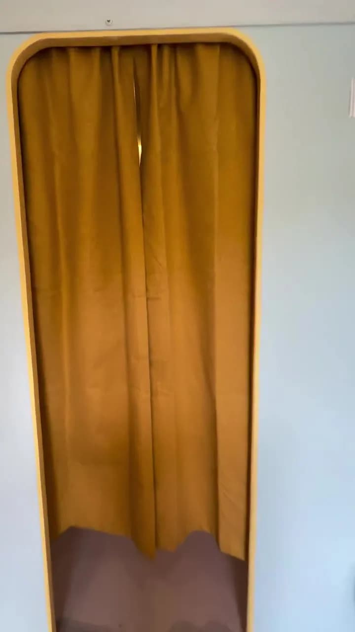 Photo booth with booth exterior curtain