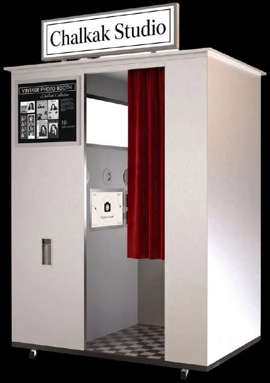 Vintage Sharp all-in-one photo booth in white with a lit sign and red curtain