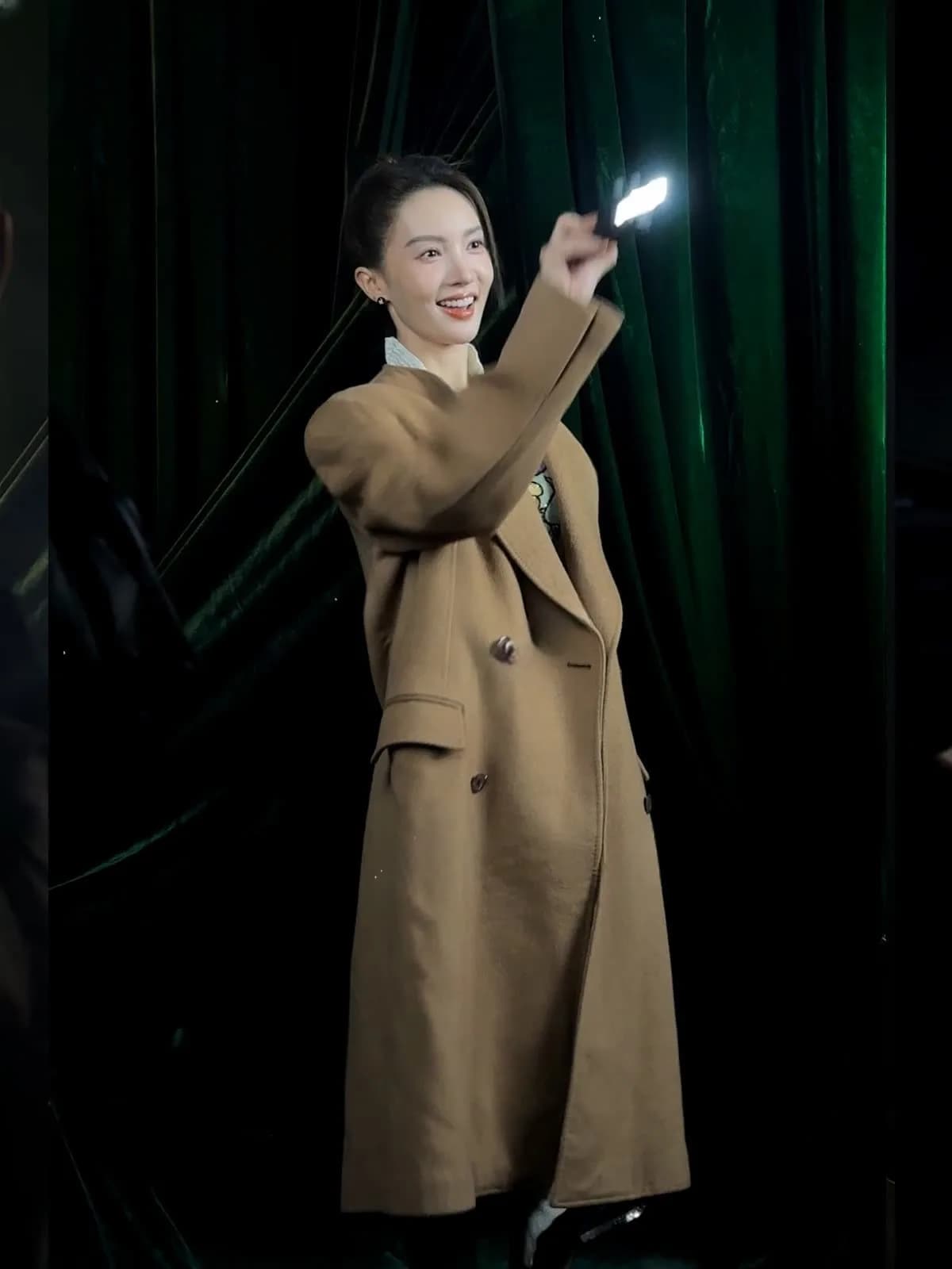 Guest holding an LED light prop