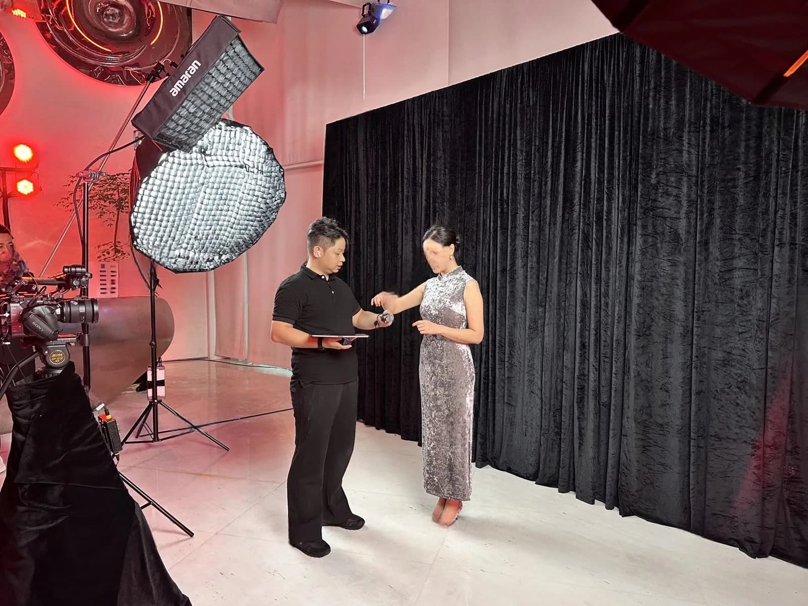 Light-painting set with studio lights and black drapes