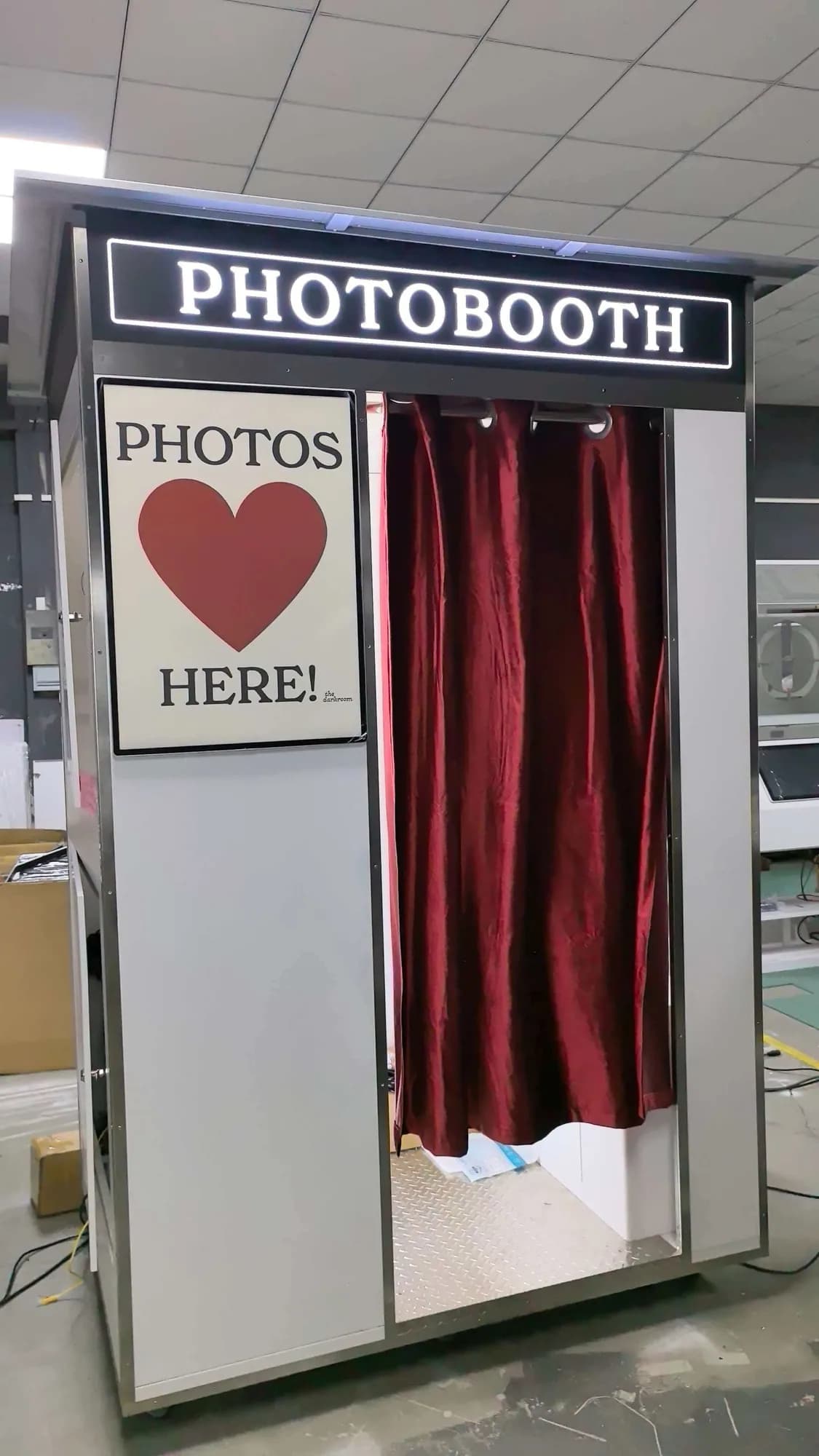 Vintage photo booth with a red curtain