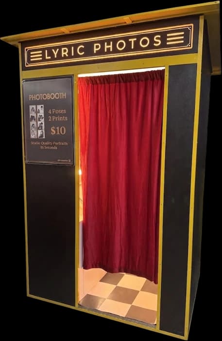 Cinema vintage photo booth in black and gold with a pitched roof and red curtain