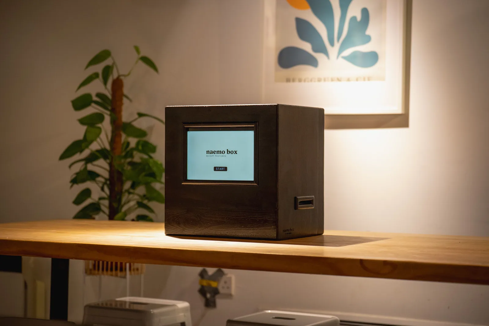 Compact photo box placed on a café counter